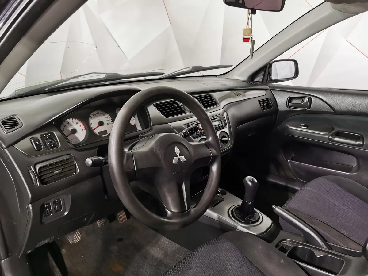 Mitsubishi Lancer 1.3 MT (82 л.с.) Черный в АВИЛОН. Слайд №19