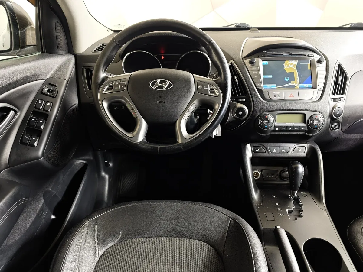 Hyundai ix35 2.0 AT 4WD (150 л.с.) Travel Коричневый в АВИЛОН. Слайд №19