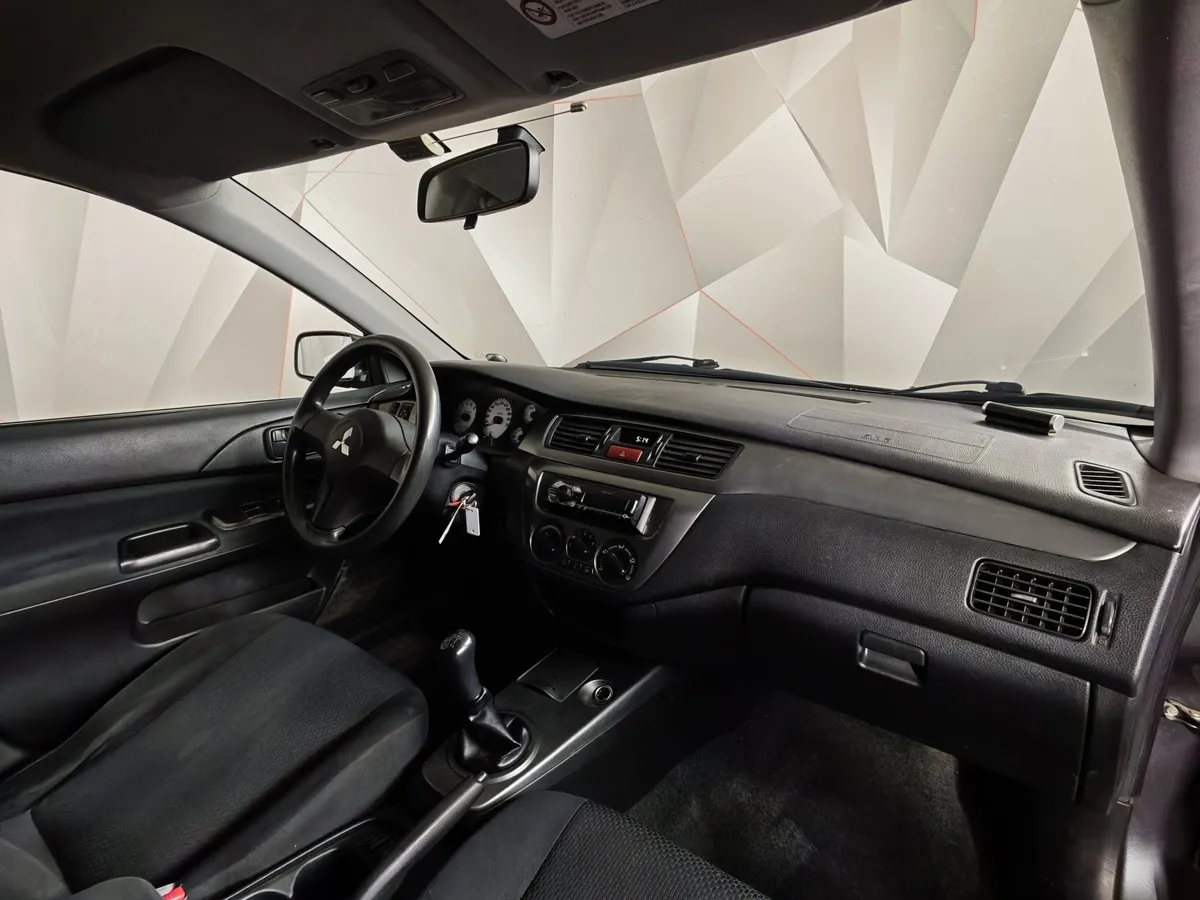 Mitsubishi Lancer 1.6 MT (100 л.с.) Серый в АВИЛОН. Слайд №10