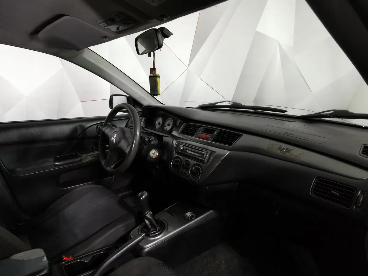 Mitsubishi Lancer 1.3 MT (82 л.с.) Черный в АВИЛОН. Слайд №13