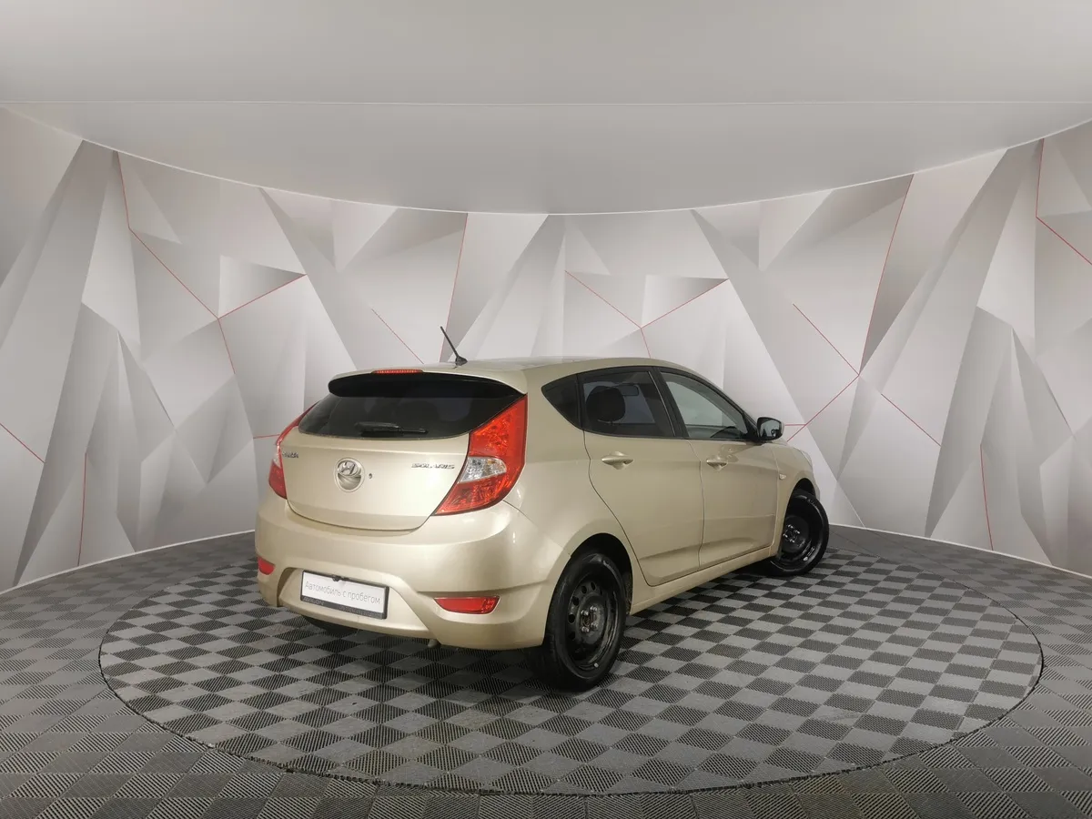 Hyundai Solaris 1.4 AT (107 л.с.) Active Бежевый в АВИЛОН. Слайд №2