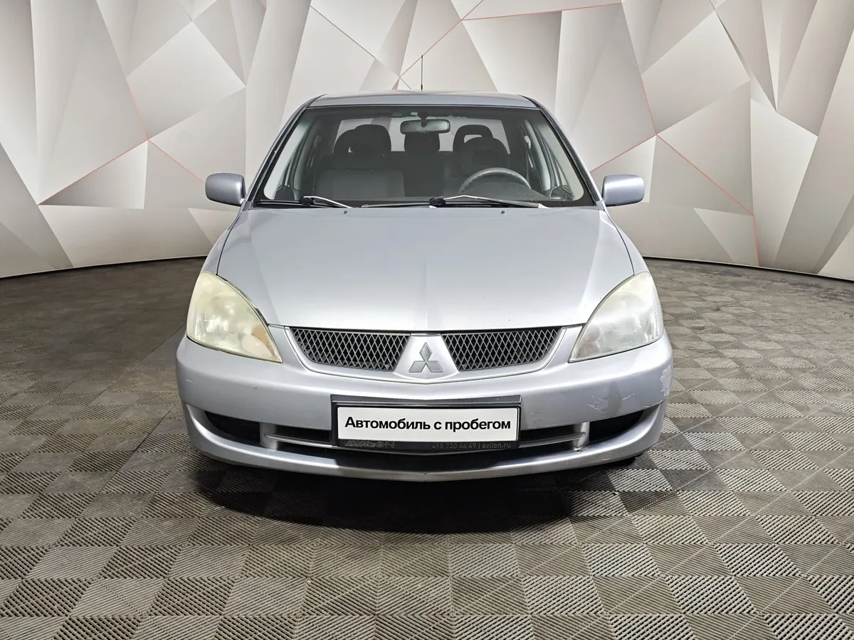 Mitsubishi Lancer 1.6 AT (98 л.с.) Серебристый в АВИЛОН. Слайд №7