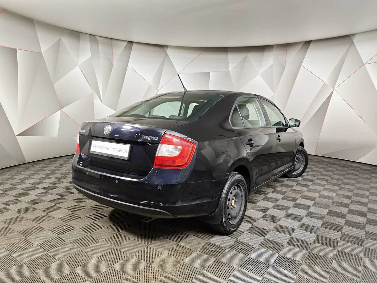 Skoda Rapid 1.6 MT (105 л.с.) Черный в АВИЛОН. Слайд №2