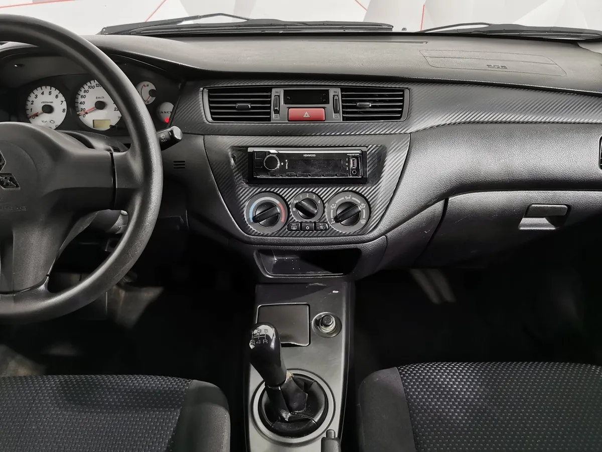 Mitsubishi Lancer 1.6 MT (98 л.с.) Серый в АВИЛОН. Слайд №14