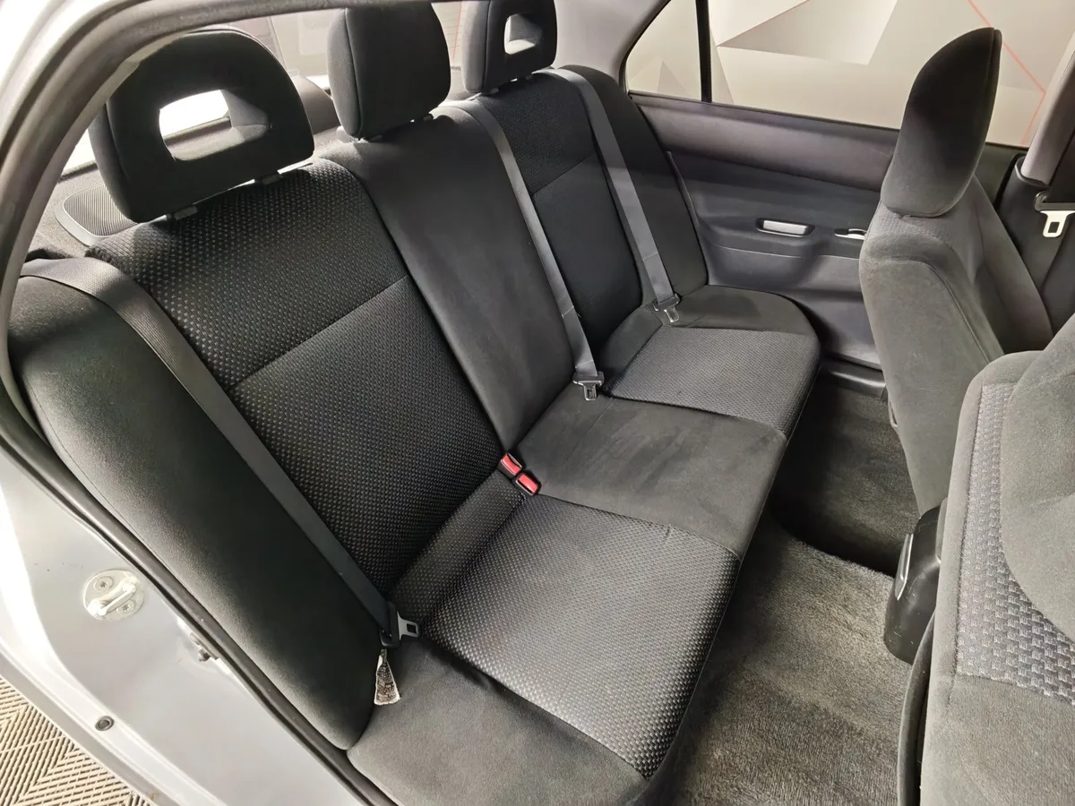 Mitsubishi Lancer 1.6 AT (98 л.с.) Серебристый в АВИЛОН. Слайд №15
