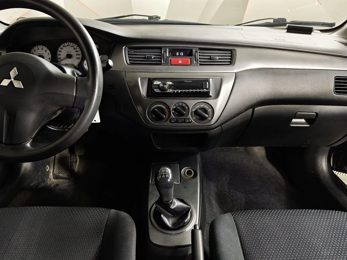 Mitsubishi Lancer 1.6 MT (100 л.с.) Серый в АВИЛОН. Слайд №12