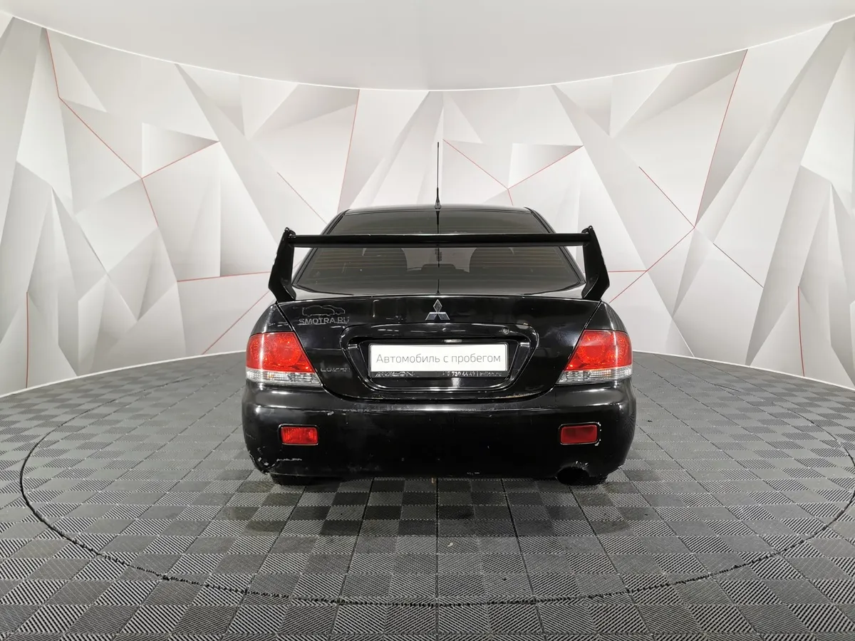 Mitsubishi Lancer 1.3 MT (82 л.с.) Черный в АВИЛОН. Слайд №8
