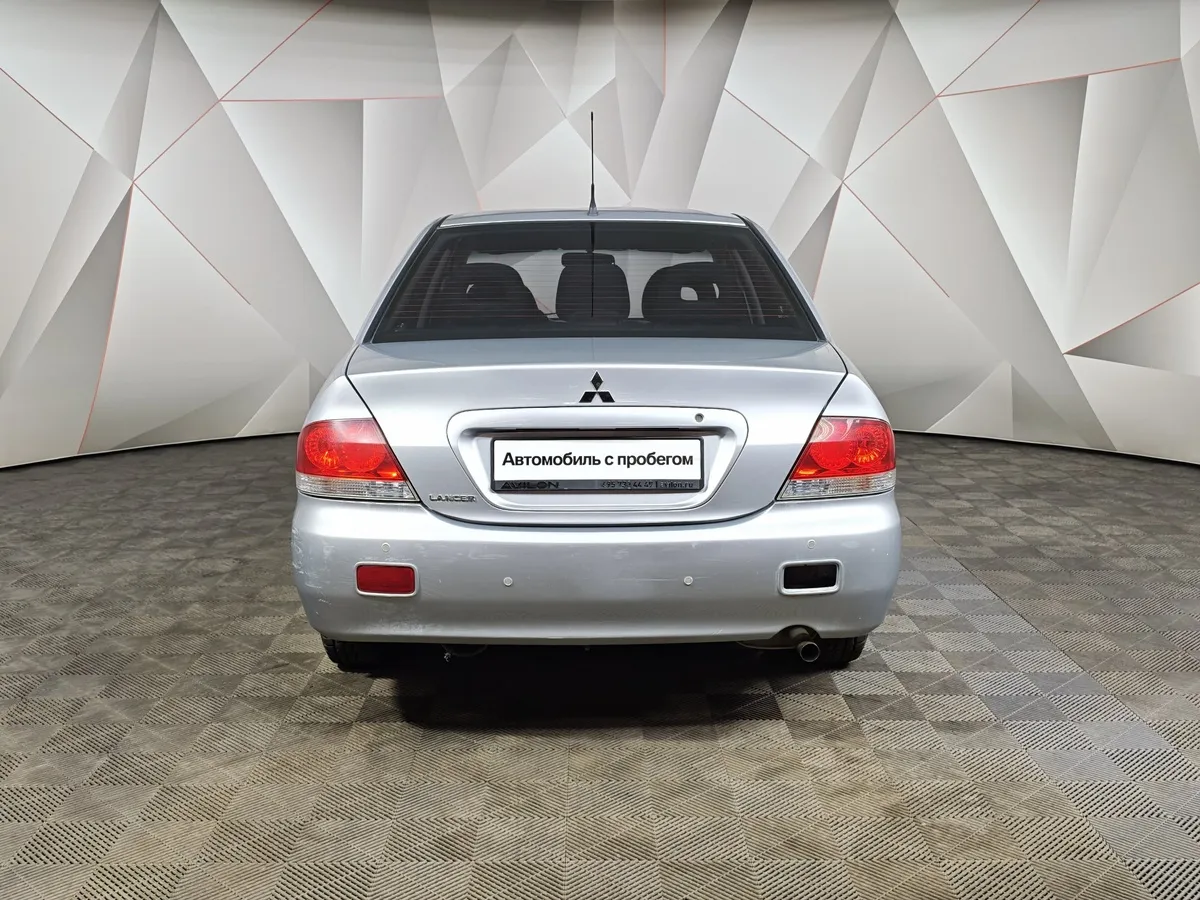 Mitsubishi Lancer 1.6 AT (98 л.с.) Серебристый в АВИЛОН. Слайд №8