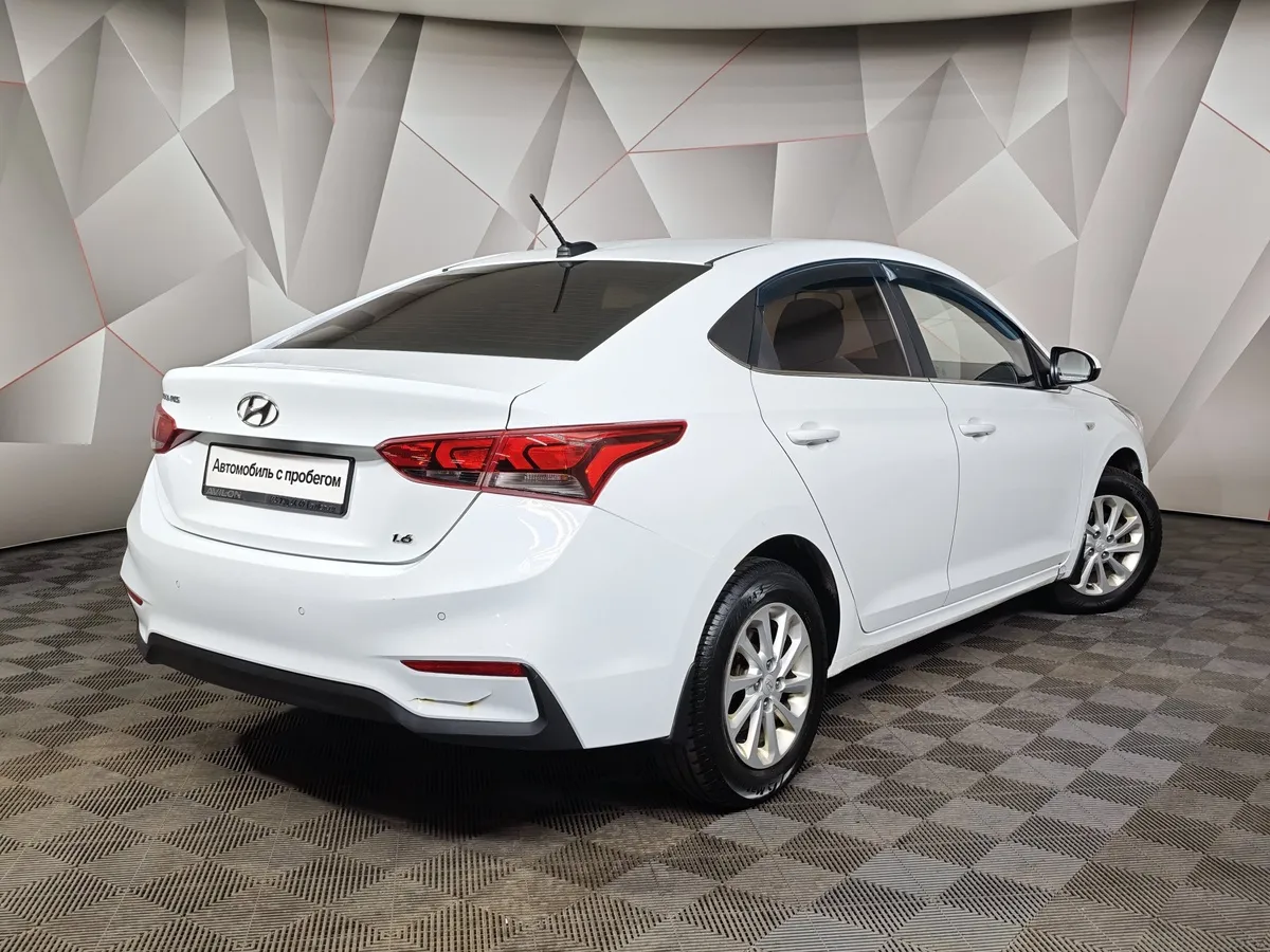 Hyundai Solaris 1.6 MT (123 л.с.) Elegance Белый в АВИЛОН. Слайд №2