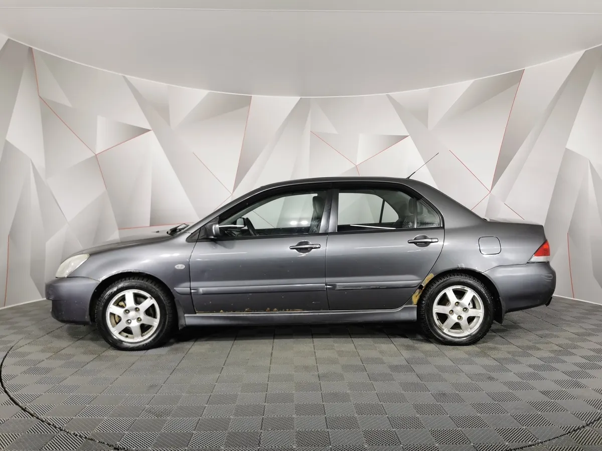 Mitsubishi Lancer 1.6 AT (98 л.с.) Серый в АВИЛОН. Слайд №5