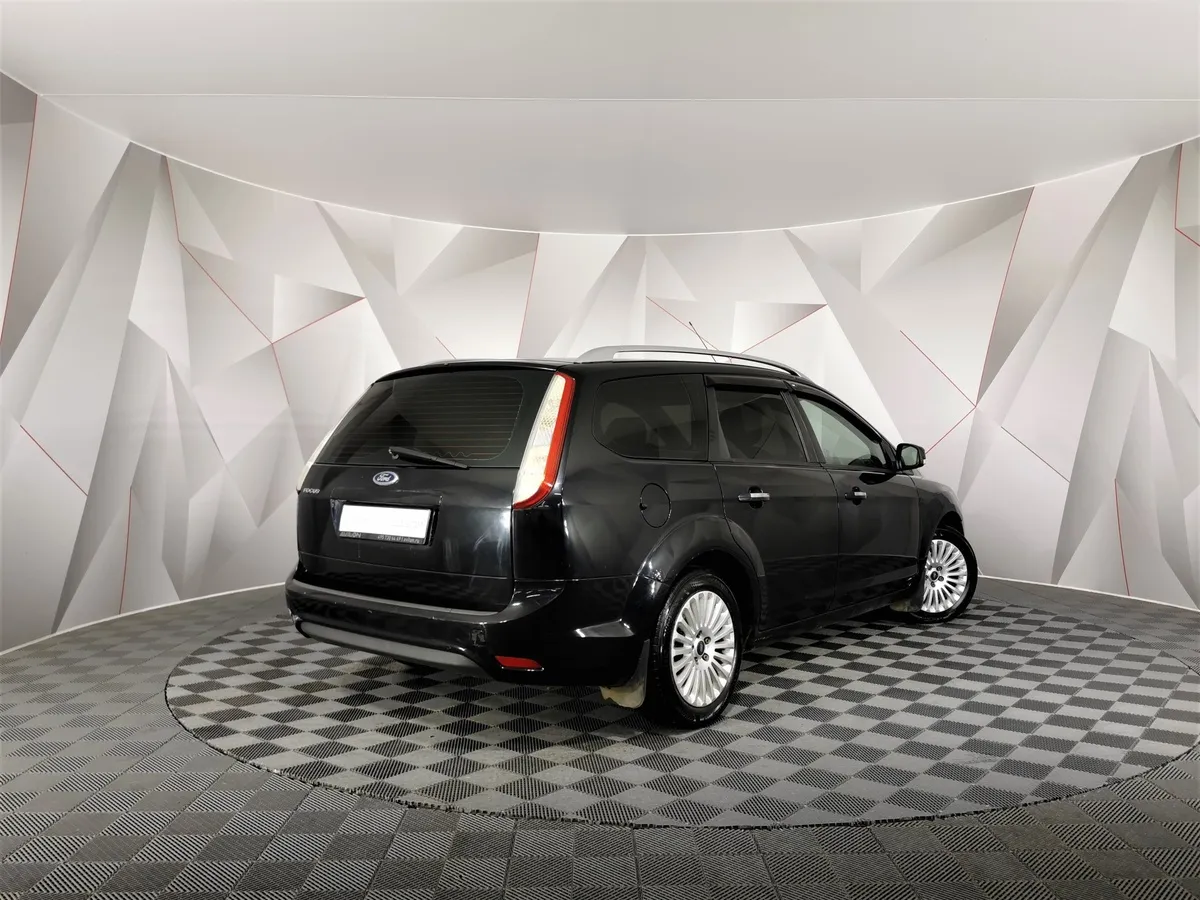 Ford Focus 2.0 AT (145 л.с.) Ghia Черный в АВИЛОН. Слайд №2