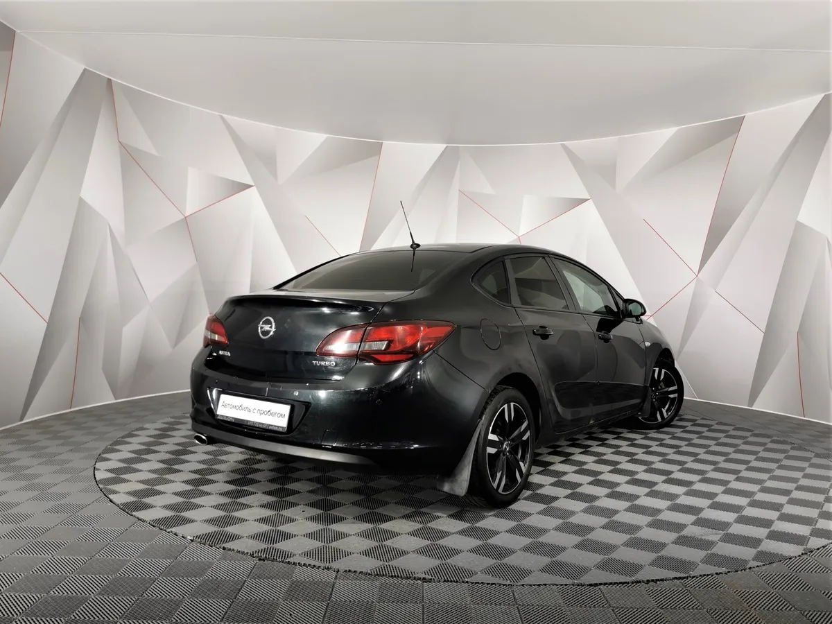 Opel Astra 1.4 Turbo AT (140 л.с.) Черный в АВИЛОН. Слайд №2