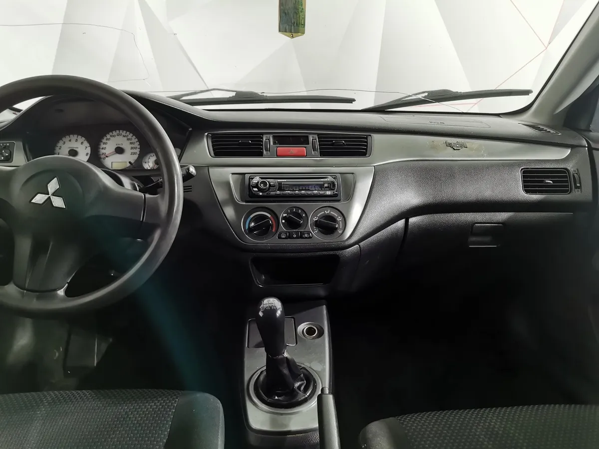 Mitsubishi Lancer 1.3 MT (82 л.с.) Черный в АВИЛОН. Слайд №15