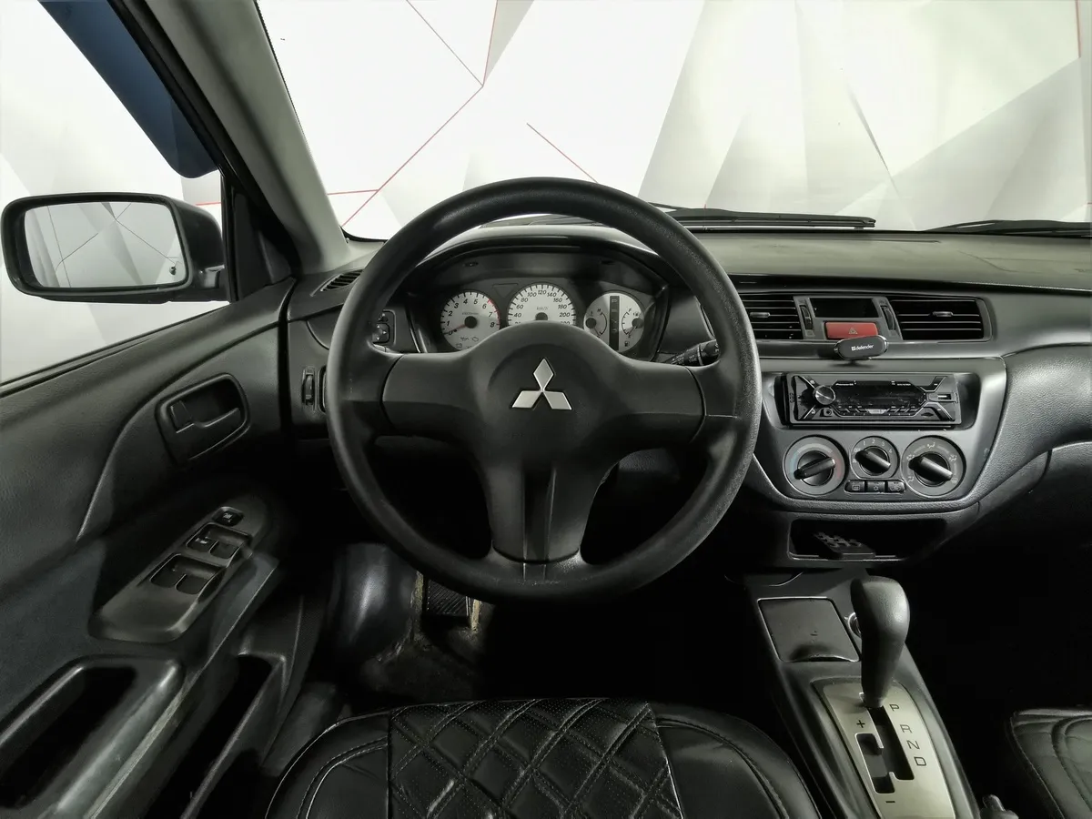 Mitsubishi Lancer 1.6 AT (98 л.с.) Серый в АВИЛОН. Слайд №17