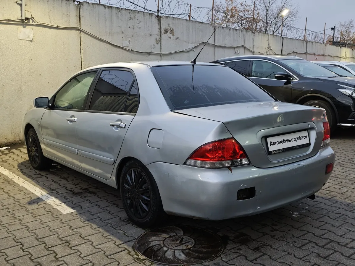 Mitsubishi Lancer 1.3 MT (82 л.с.) Белый в АВИЛОН. Слайд №4