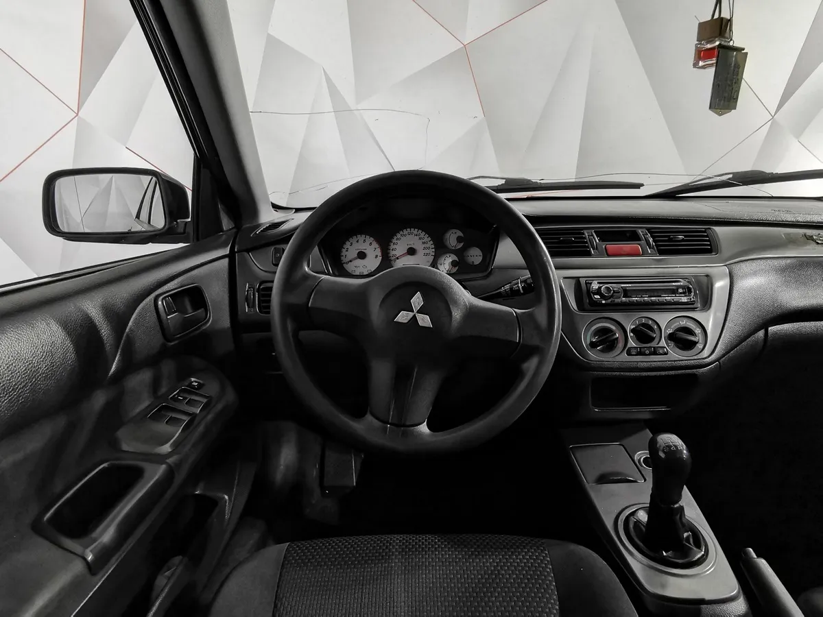 Mitsubishi Lancer 1.3 MT (82 л.с.) Черный в АВИЛОН. Слайд №20
