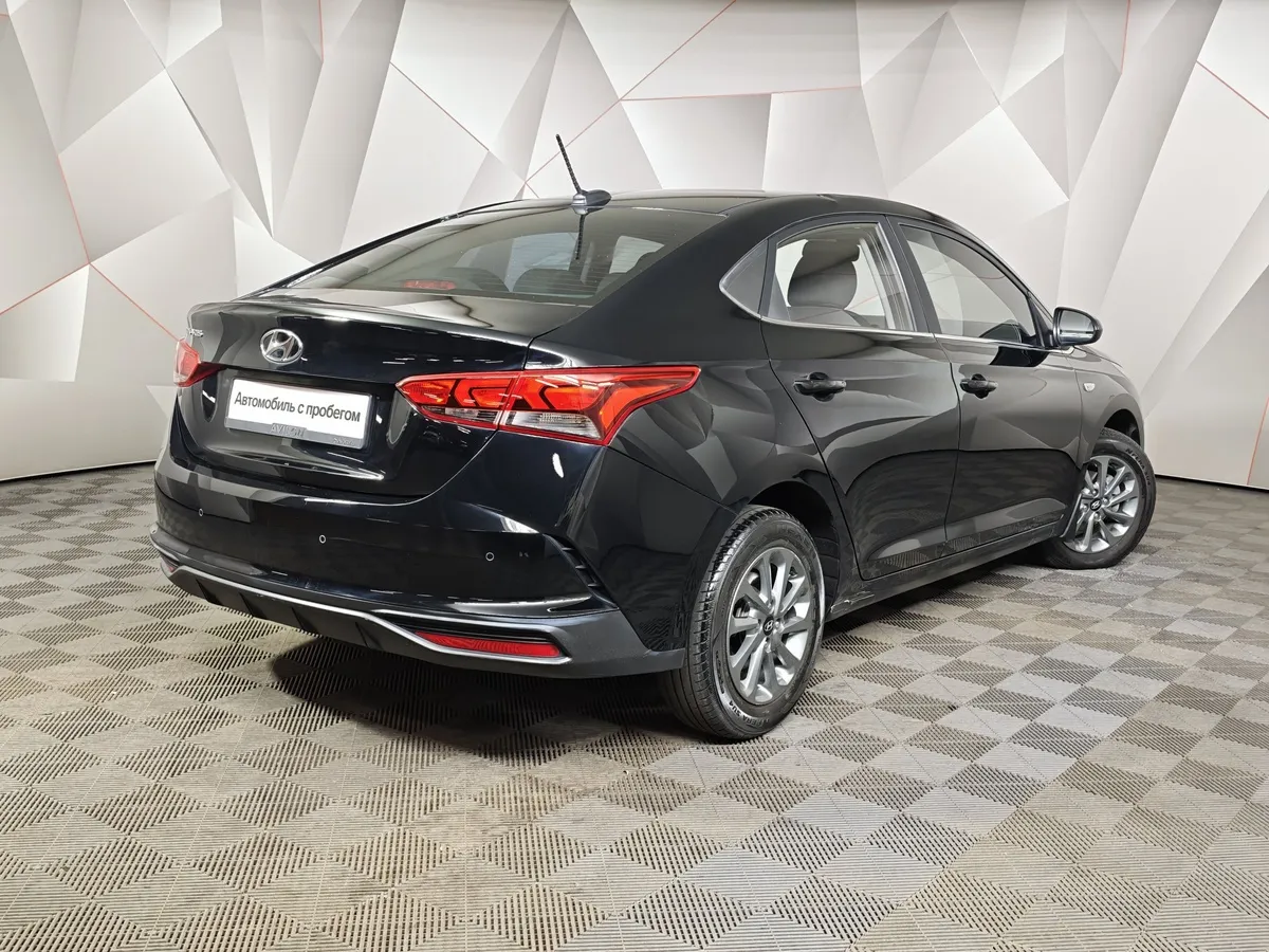Hyundai Solaris 1.6 AT (123 л.с.) Elegance Черный в АВИЛОН. Слайд №2