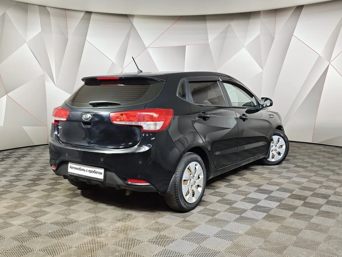 Kia Rio 1.4 AT (107 л.с.) Черный в АВИЛОН. Слайд №2