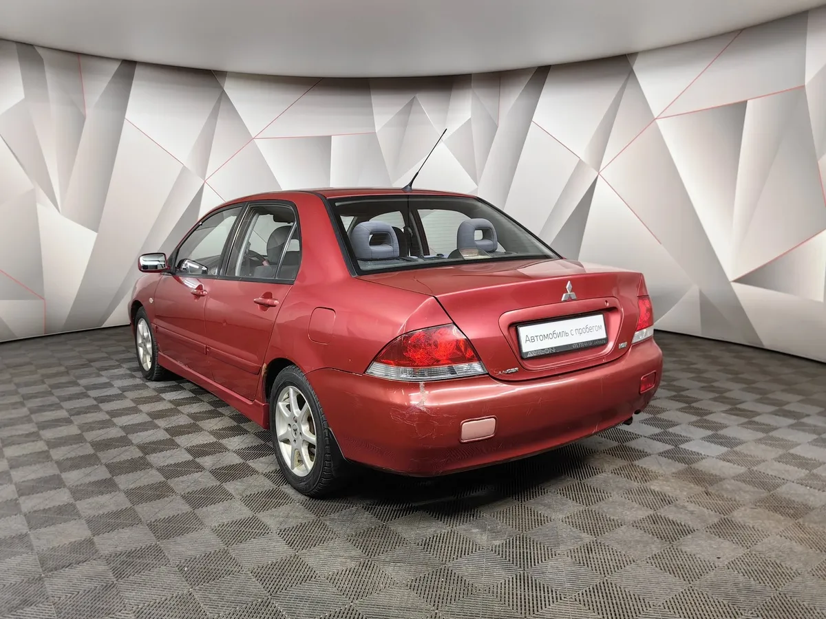 Mitsubishi Lancer 1.6 AT (98 л.с.) Красный в АВИЛОН. Слайд №4