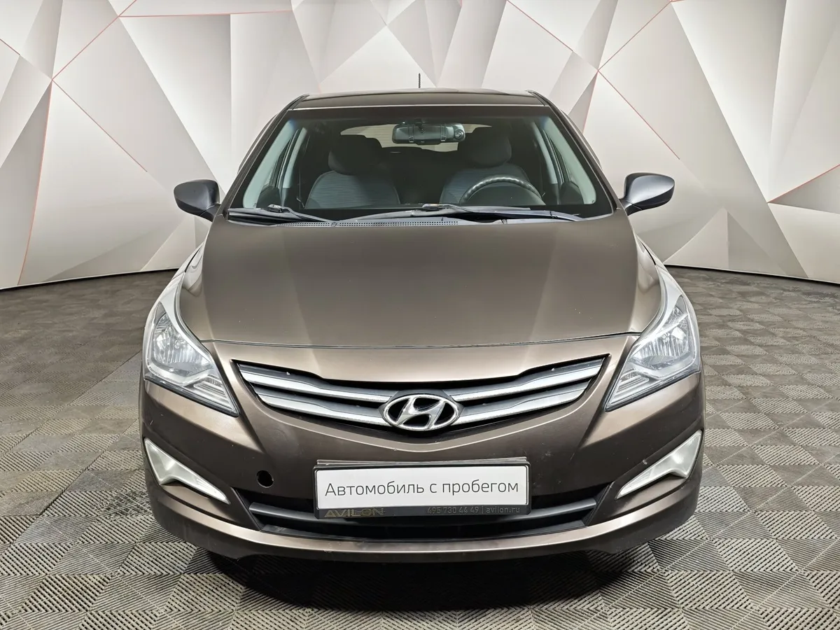 Hyundai Solaris 1.4 AT (107 л.с.) Classic Коричневый в АВИЛОН. Слайд №7