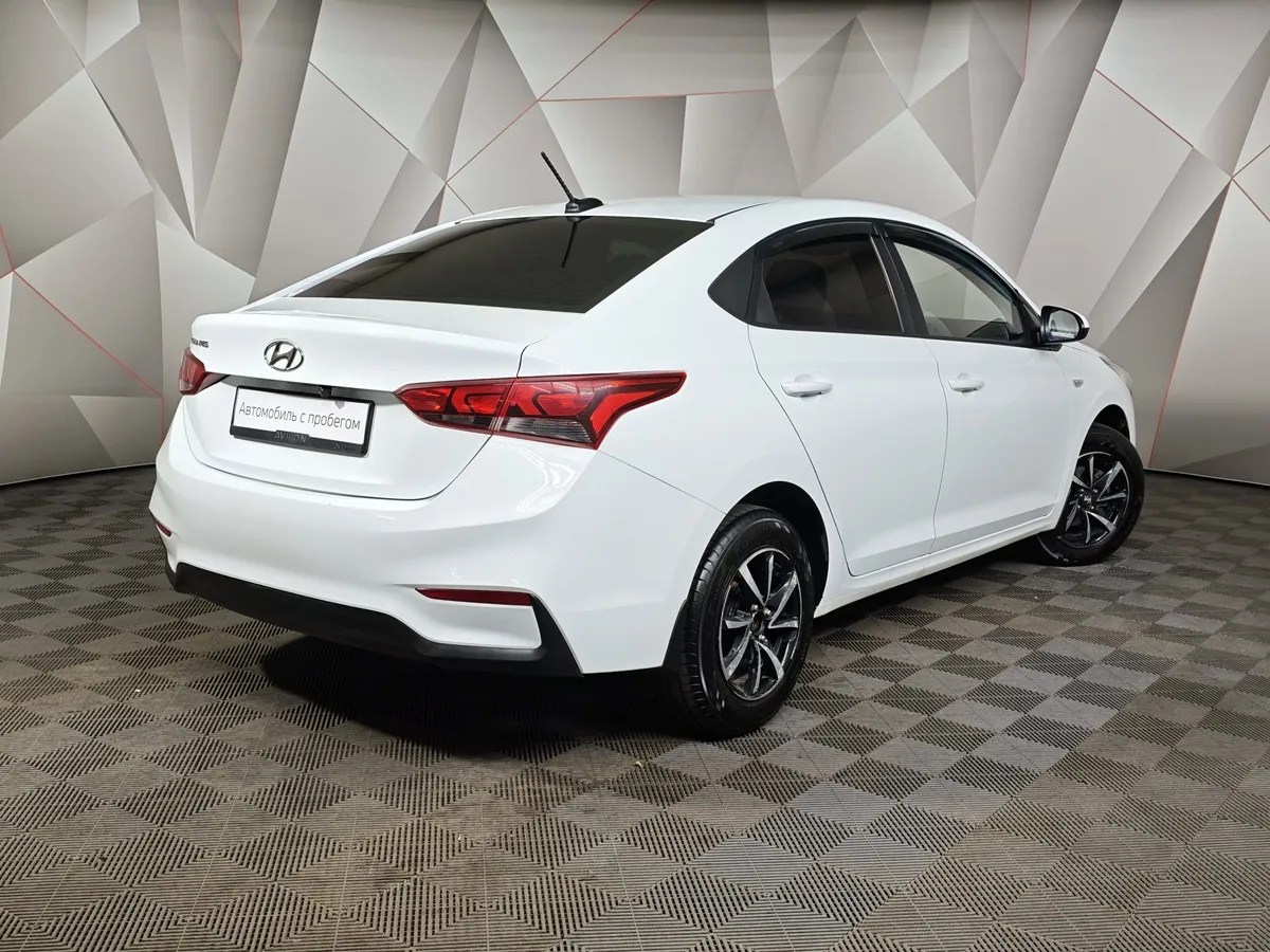 Hyundai Solaris 1.4 AT (107 л.с.) Active Белый в АВИЛОН. Слайд №2