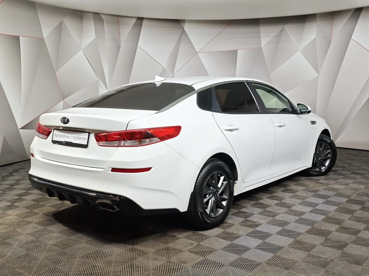 Kia Optima 2.0 AT (150 л.с.) Classic Белый в АВИЛОН. Слайд №2