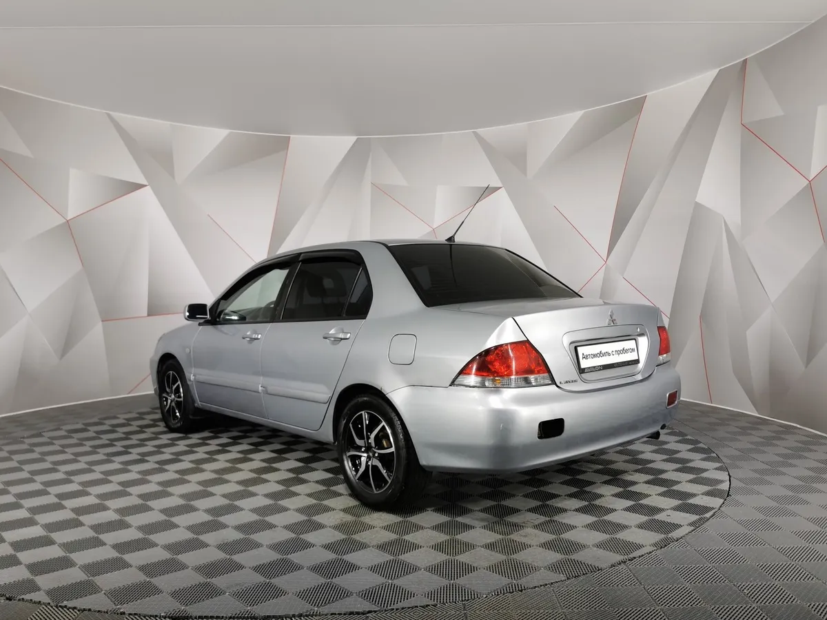 Mitsubishi Lancer 1.6 MT (98 л.с.) Серый в АВИЛОН. Слайд №4