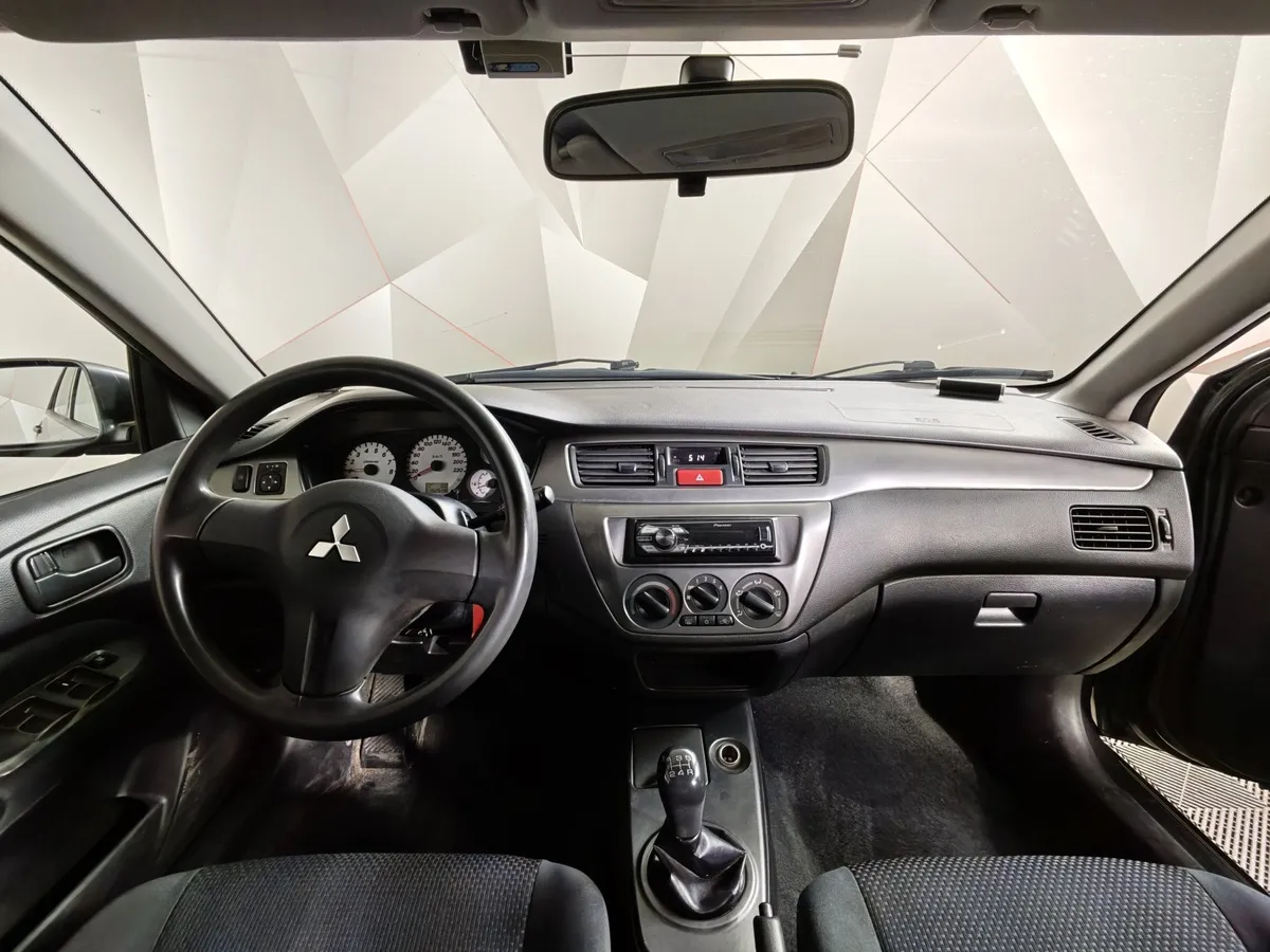 Mitsubishi Lancer 1.6 MT (100 л.с.) Серый в АВИЛОН. Слайд №11