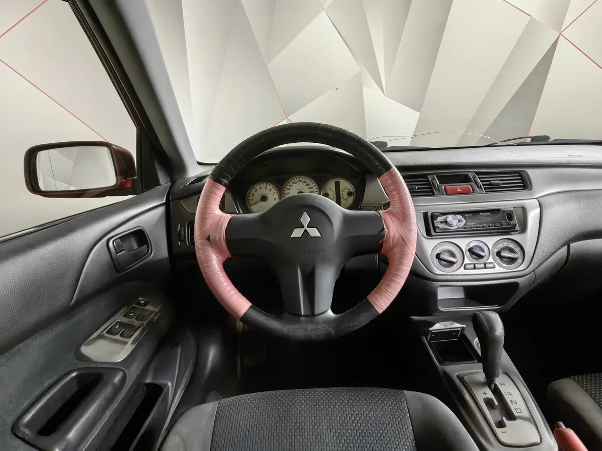 Mitsubishi Lancer 1.6 AT (98 л.с.) Красный в АВИЛОН. Слайд №15