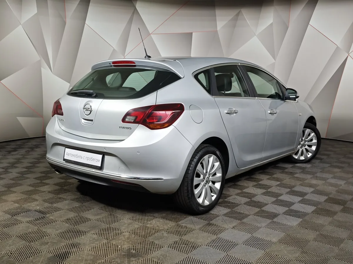 Opel Astra 1.4 Turbo AT (140 л.с.) Серебристый в АВИЛОН. Слайд №2