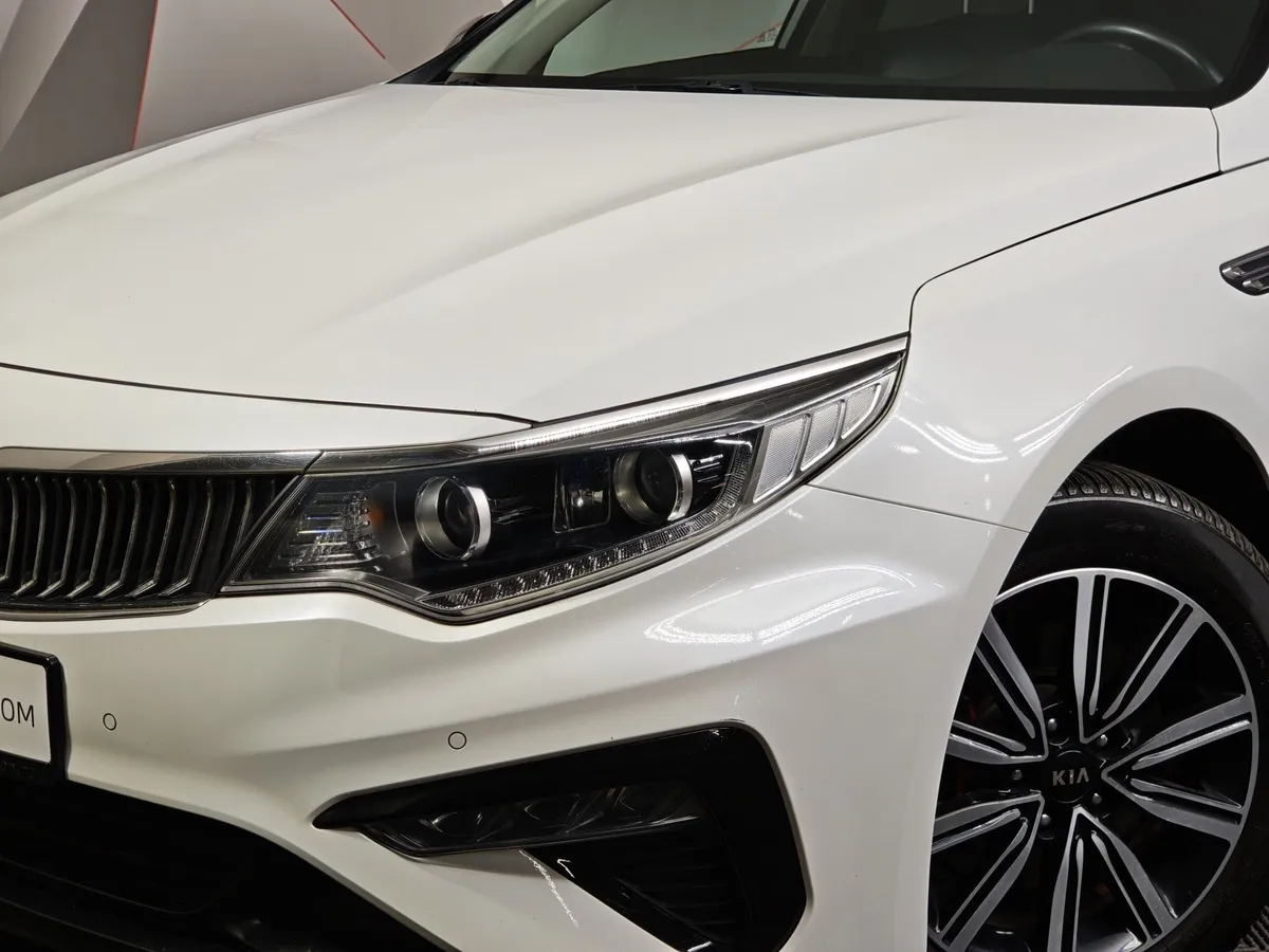 Kia Optima 2.0 AT (150 л.с.) Fleet Белый в АВИЛОН. Слайд №9