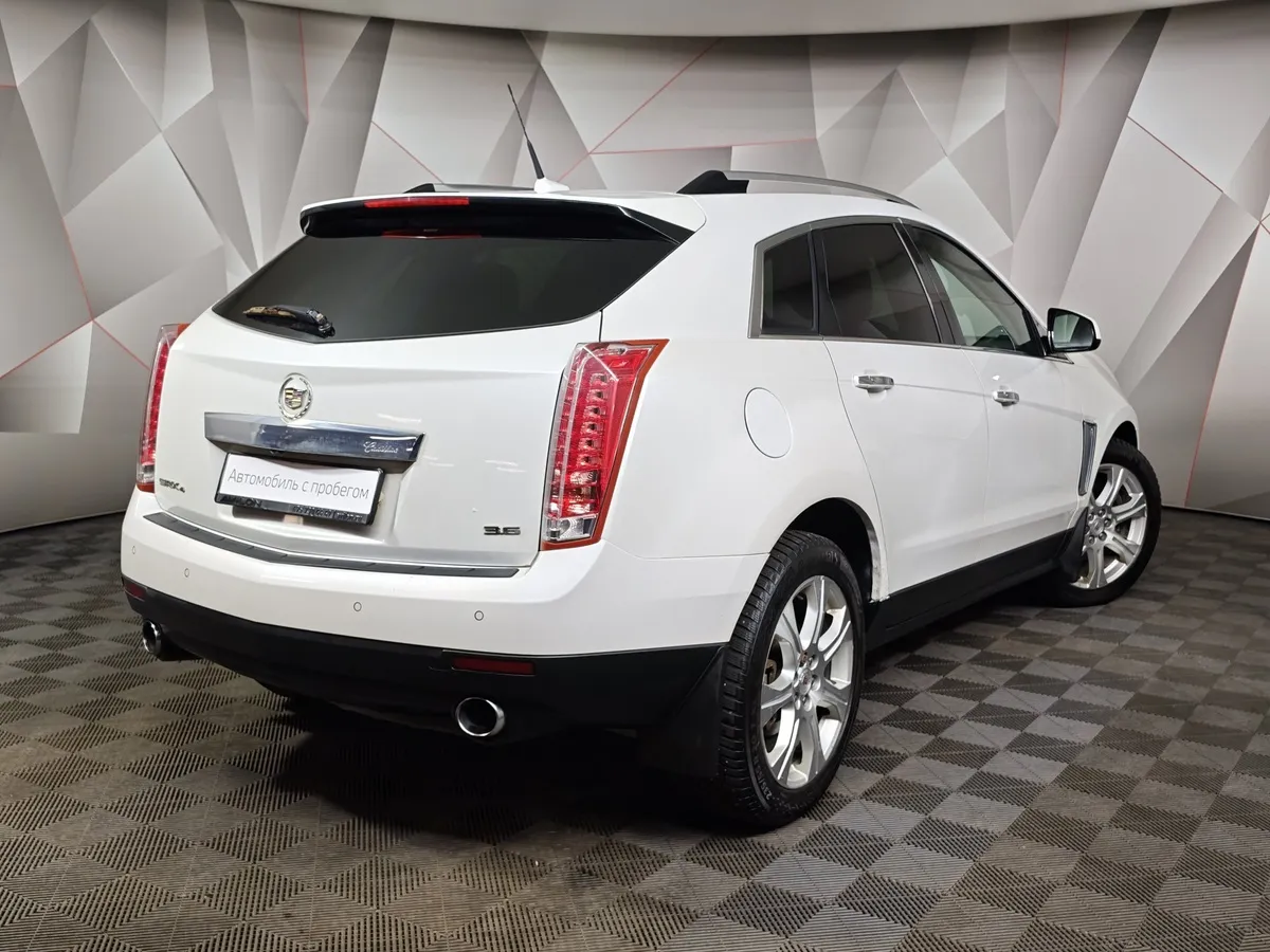 Cadillac SRX 3.6 AT AWD (318 л.с.) Белый в АВИЛОН. Слайд №2