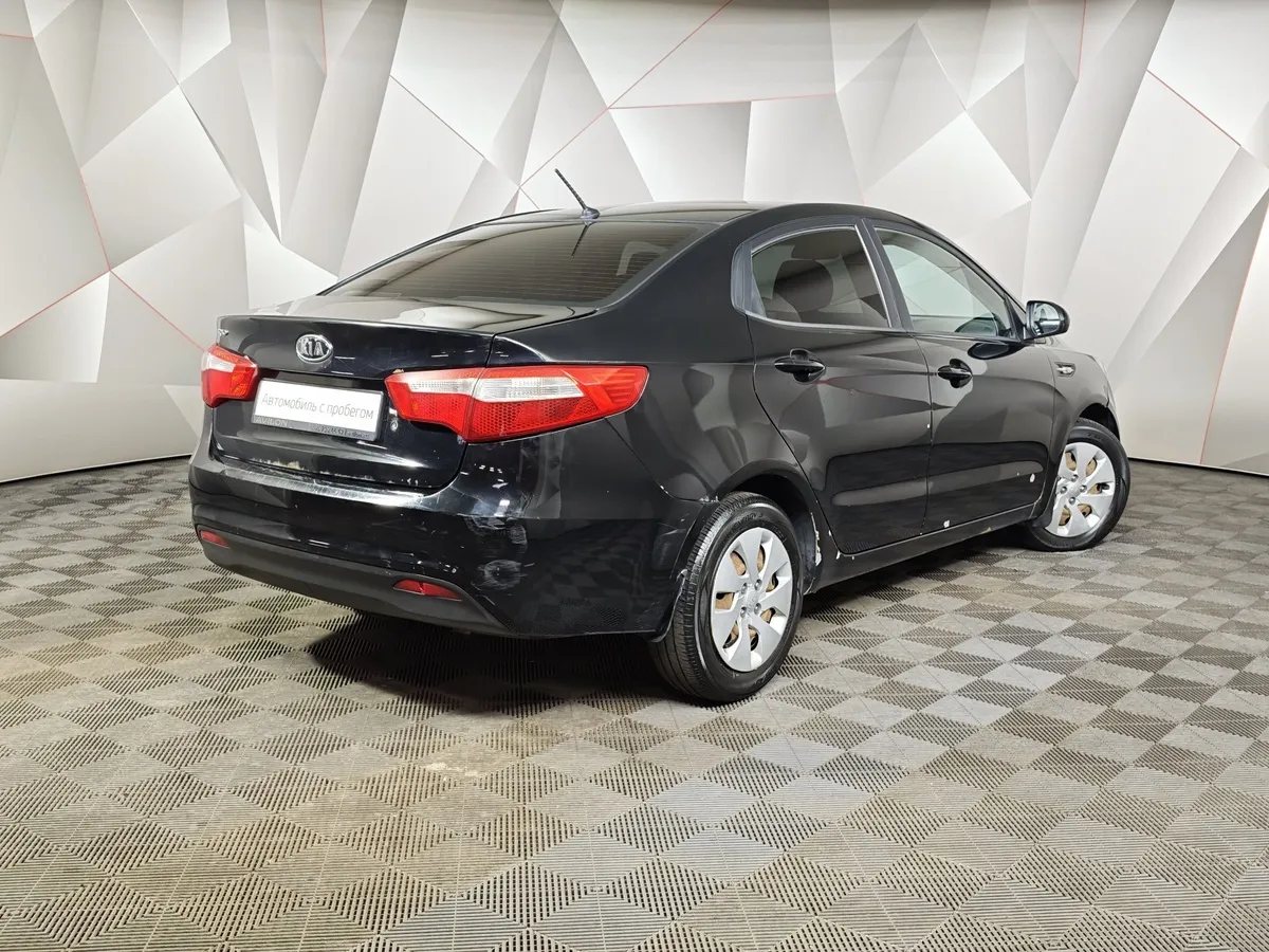 Kia Rio 1.4 MT (107 л.с.) Черный в АВИЛОН. Слайд №2