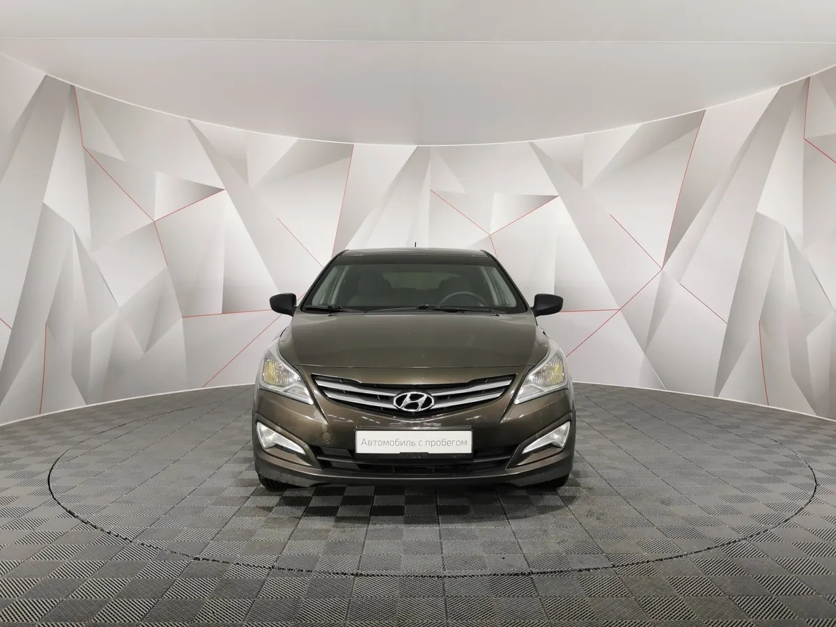 Hyundai Solaris 1.4 MT (107 л.с.) Active Коричневый в АВИЛОН. Слайд №7