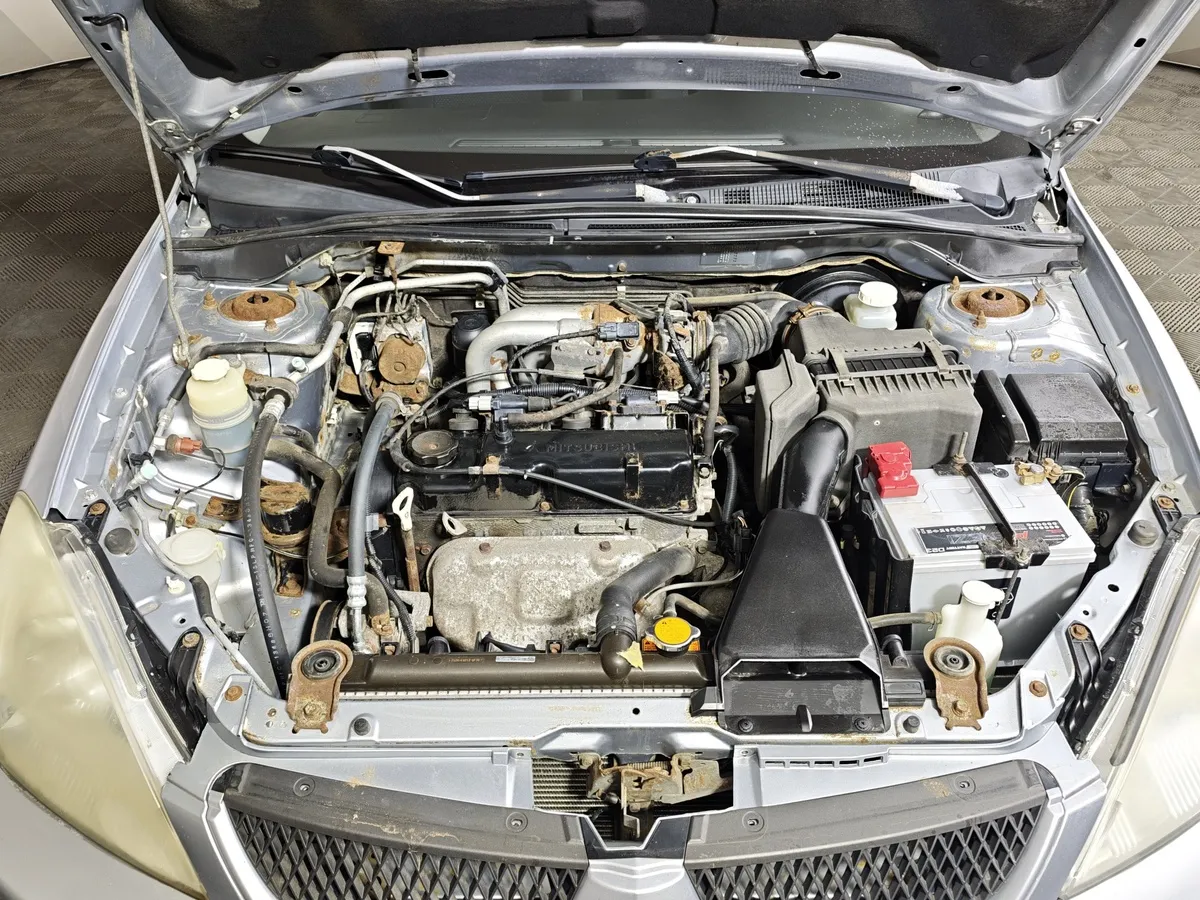 Mitsubishi Lancer 1.6 AT (98 л.с.) Серебристый в АВИЛОН. Слайд №10