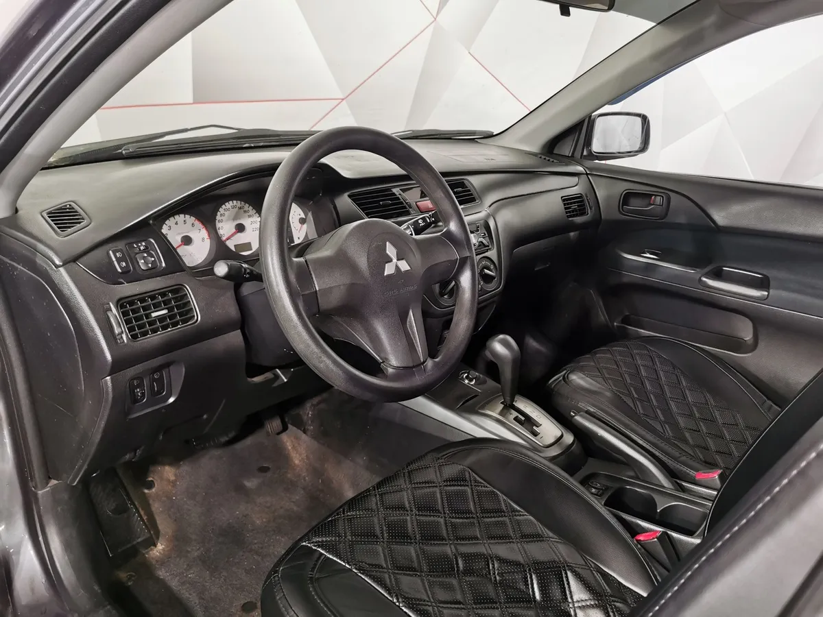 Mitsubishi Lancer 1.6 AT (98 л.с.) Серый в АВИЛОН. Слайд №16