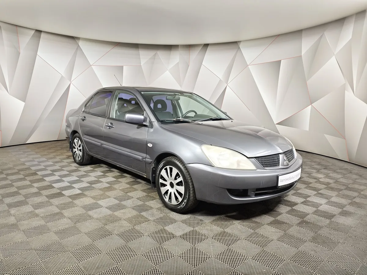 Mitsubishi Lancer 1.6 MT (100 л.с.) Серый в АВИЛОН. Слайд №3