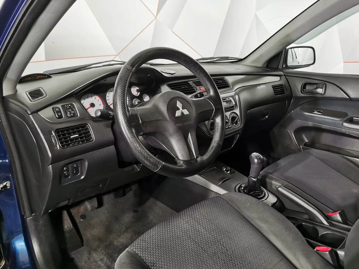 Mitsubishi Lancer 1.6 MT (100 л.с.) Синий в АВИЛОН. Слайд №17