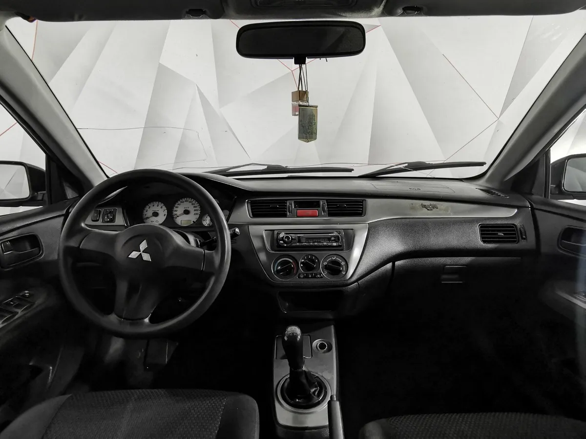 Mitsubishi Lancer 1.3 MT (82 л.с.) Черный в АВИЛОН. Слайд №14