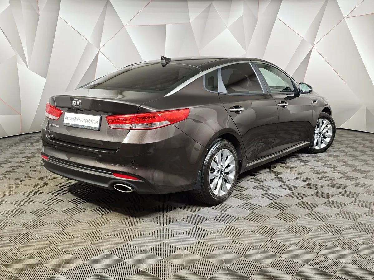 Kia Optima 2.0 AT (150 л.с.) Коричневый в АВИЛОН. Слайд №2