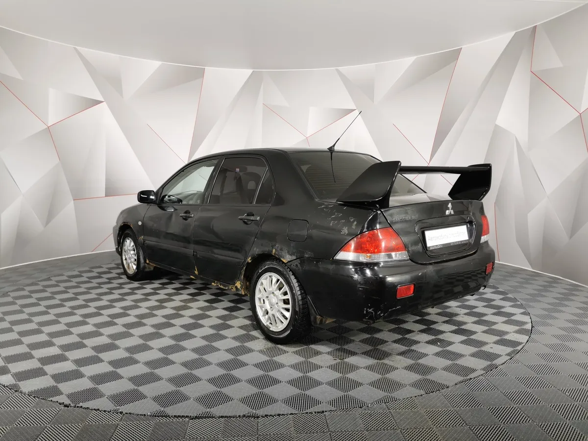 Mitsubishi Lancer 1.3 MT (82 л.с.) Черный в АВИЛОН. Слайд №4