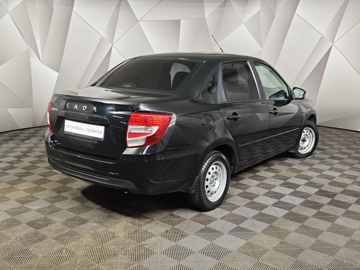 ВАЗ (Lada) Granta 1.6 MT 8кл (87 л.с.) Черный в АВИЛОН. Слайд №2