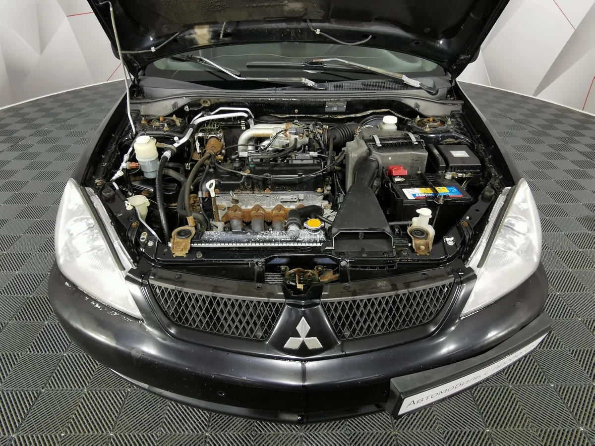 Mitsubishi Lancer 1.3 MT (82 л.с.) Черный в АВИЛОН. Слайд №11