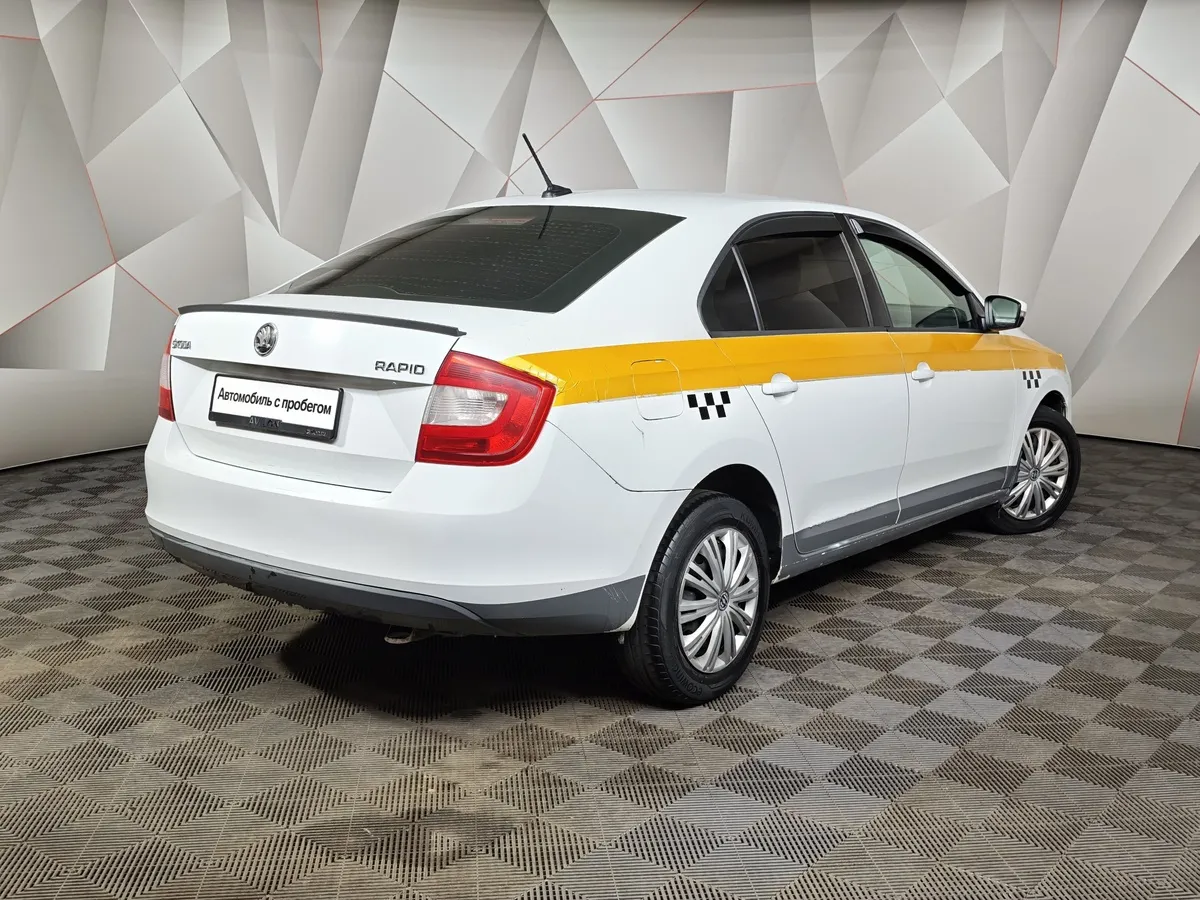 Skoda Rapid 1.6 AT (110 л.с.) Белый в АВИЛОН. Слайд №2