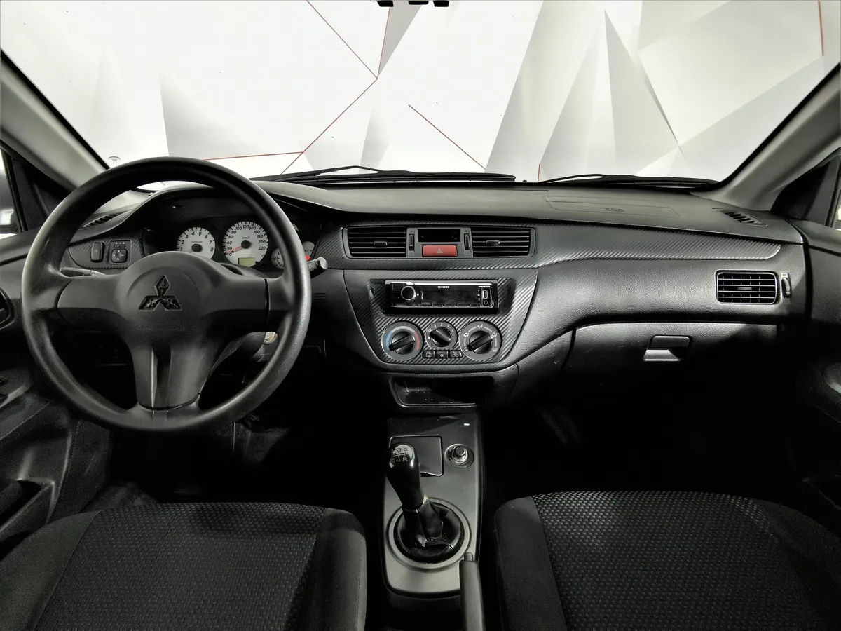 Mitsubishi Lancer 1.6 MT (98 л.с.) Серый в АВИЛОН. Слайд №13