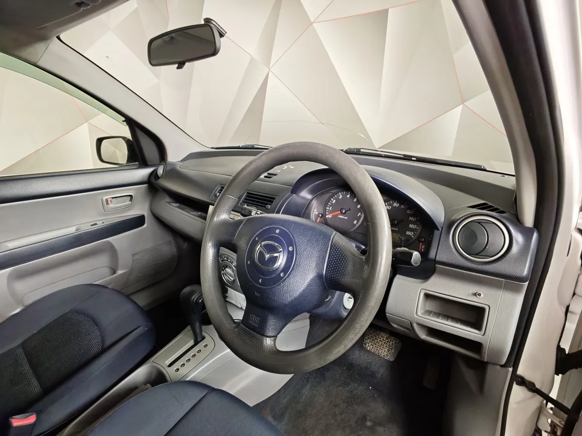 Mazda Demio 1.5 AT (100 л.с.) Белый в АВИЛОН. Слайд №11