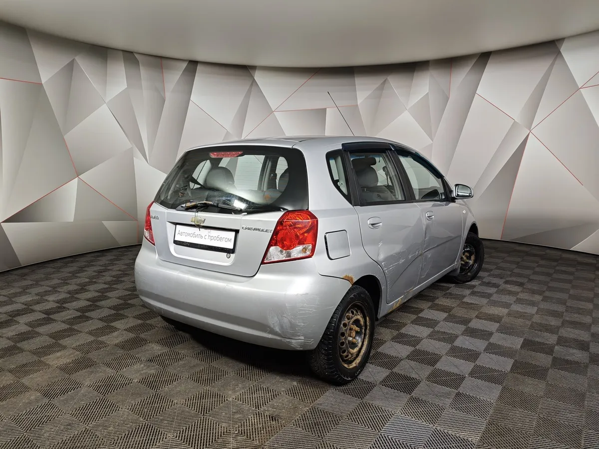 Chevrolet Aveo 1.2i MT (72 л.с.) Серебристый в АВИЛОН. Слайд №2