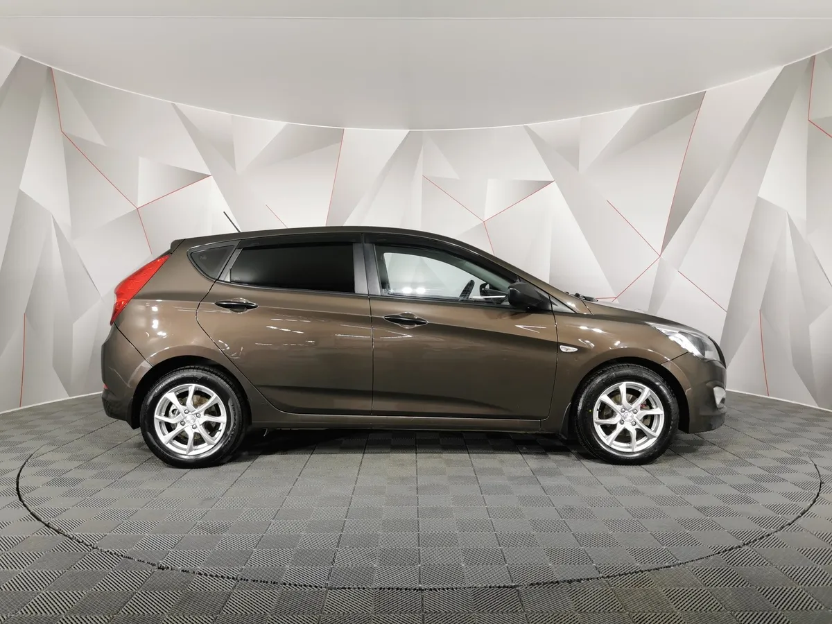 Hyundai Solaris 1.4 MT (107 л.с.) Active Коричневый в АВИЛОН. Слайд №6