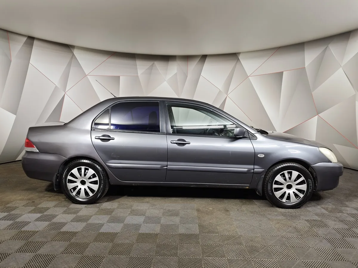 Mitsubishi Lancer 1.6 MT (100 л.с.) Серый в АВИЛОН. Слайд №6