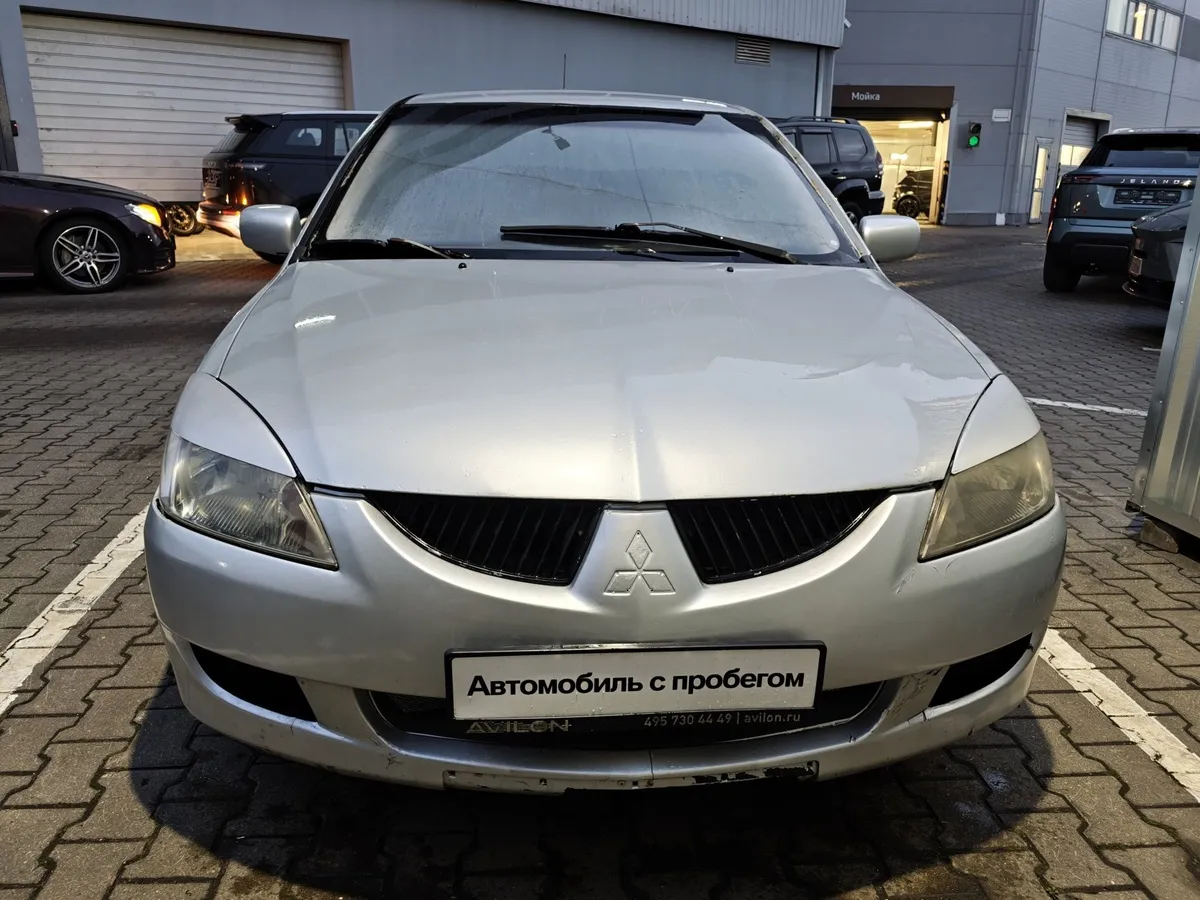 Mitsubishi Lancer 1.3 MT (82 л.с.) Белый в АВИЛОН. Слайд №6